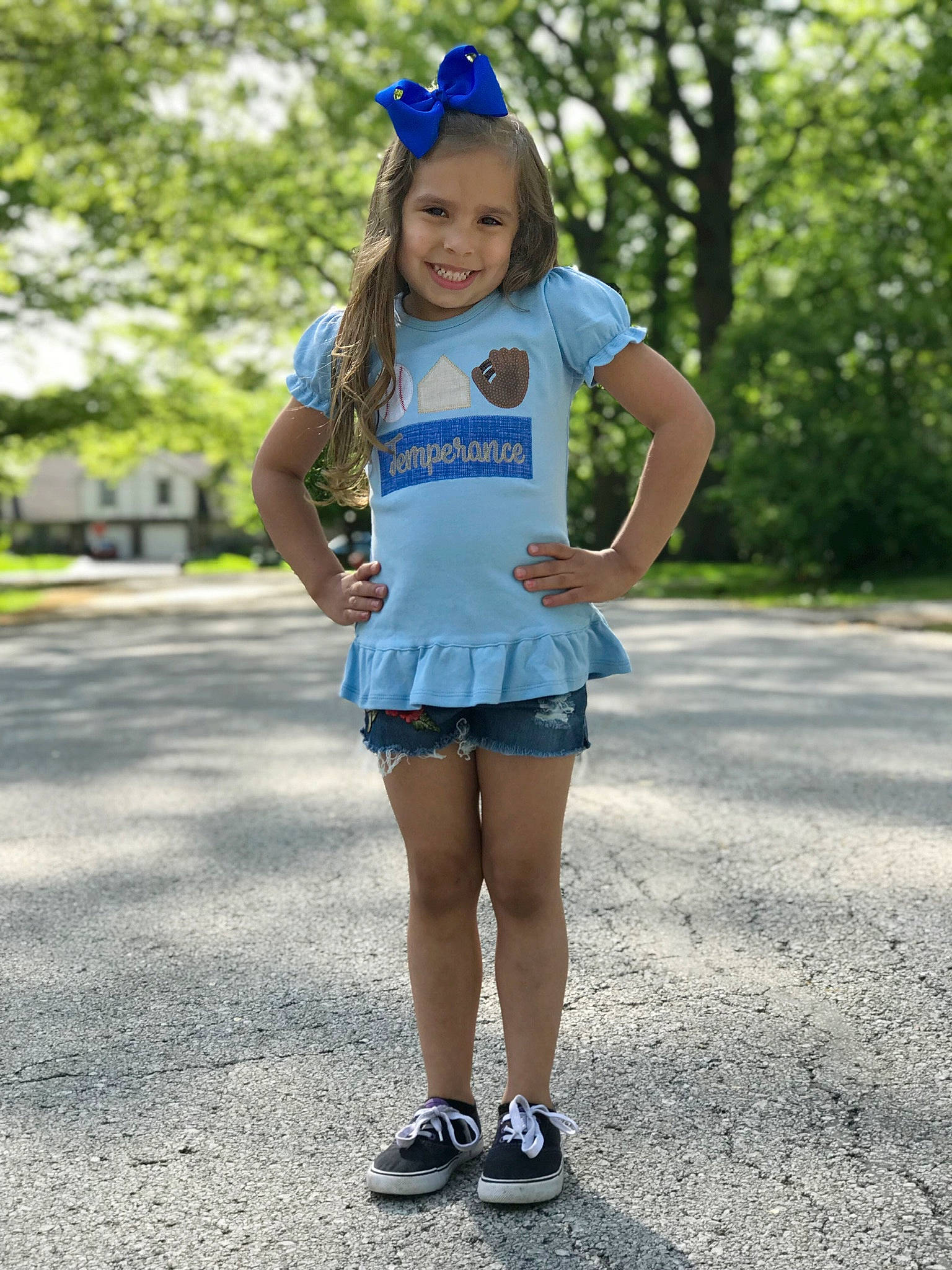 Temperance is registered to the contest to win money with this photo: asphalt, denim, electric_blue, goggles, hat, human_leg, joy, knee, leisure, long_hair, pattern, person, road, shoulder, sleeve, smile, street_fashion, summer, t_shirt, thigh