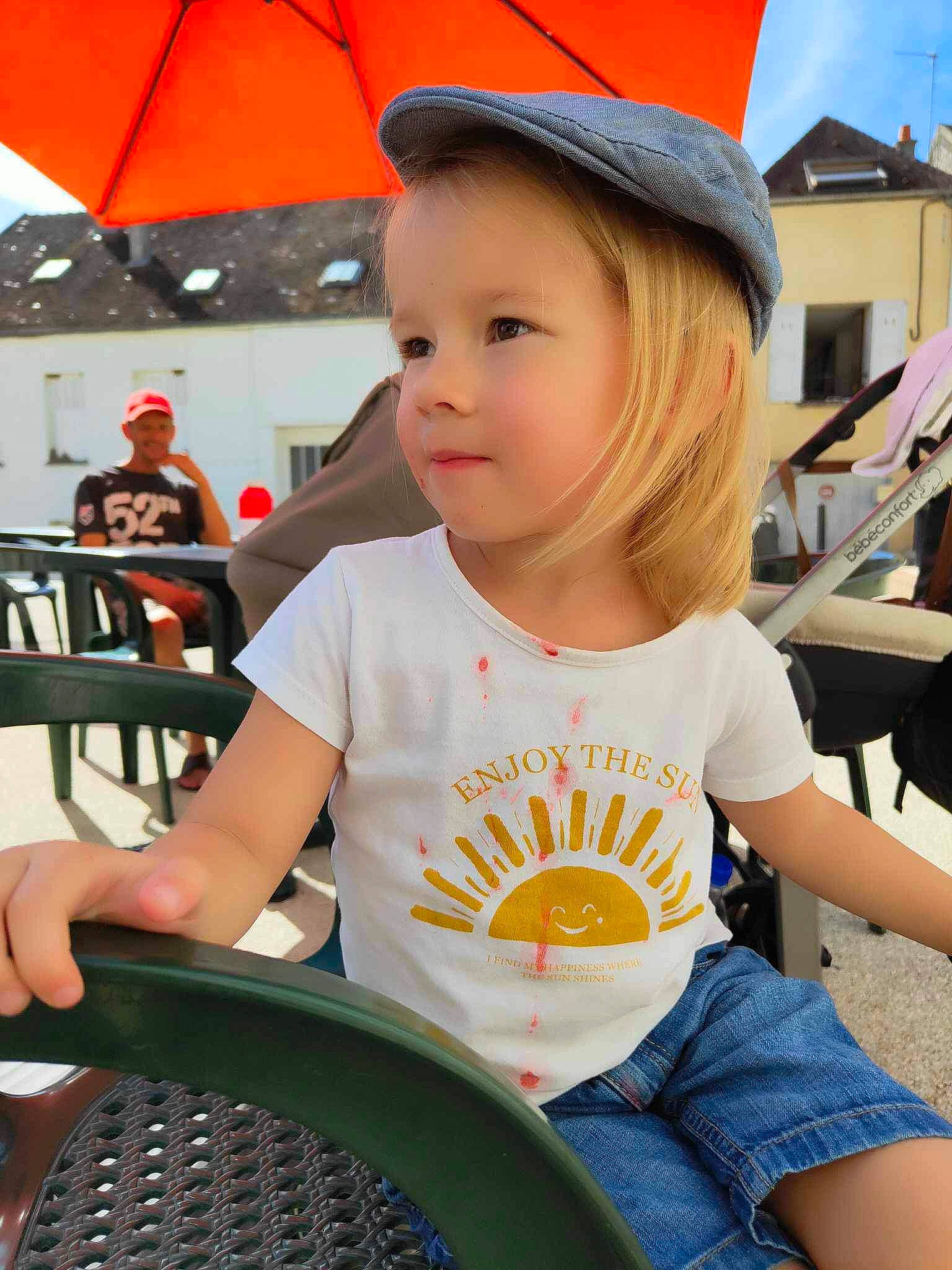 Elya participe au concours pour gagner de l'argent avec cette photo : cap, chair, child, clothing, fun, happy, head, headwear, joy, leisure, organ, person, photograph, product, recreation, red, sitting, smile, snapshot, thigh