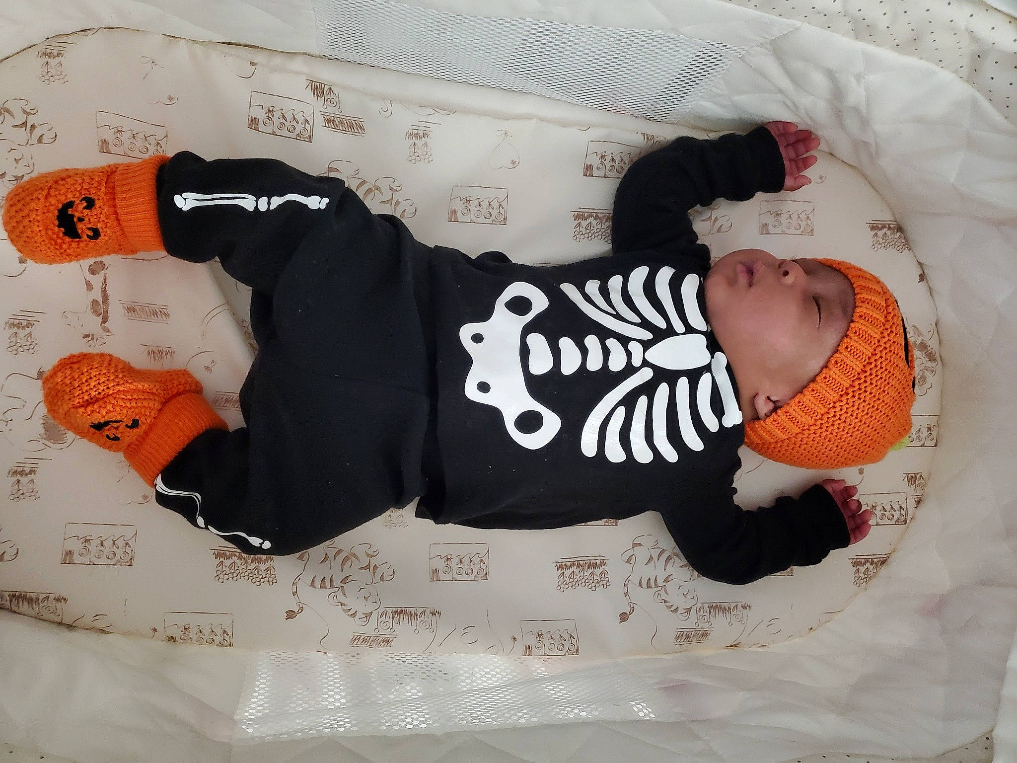 Everett is registered to the contest to win money with this photo: arm, baby, baby_sleeping, baby_toddler_clothing, carmine, child, comfort, creative_arts, font, head, headgear, headwear, linens, paper, pattern, person, product, sleeve, t_shirt, textile
