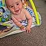 Louie joined the competition — help win amazing prizes! baby, smiling, play_mat, toys, indoor, child, happy, cute, face, hands, carpet, colorful, play_gym, infant, young_child, closeup, portrait, skin, expression, fun