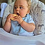 Louie joined the competition — help win amazing prizes! baby, high_chair, cookie, bib, blue_clothing, blonde_hair, animal_print, cute, chubby_cheeks, eating, infant, portrait, indoor, child, seat, hand, face, mouth_open, curious, toddler