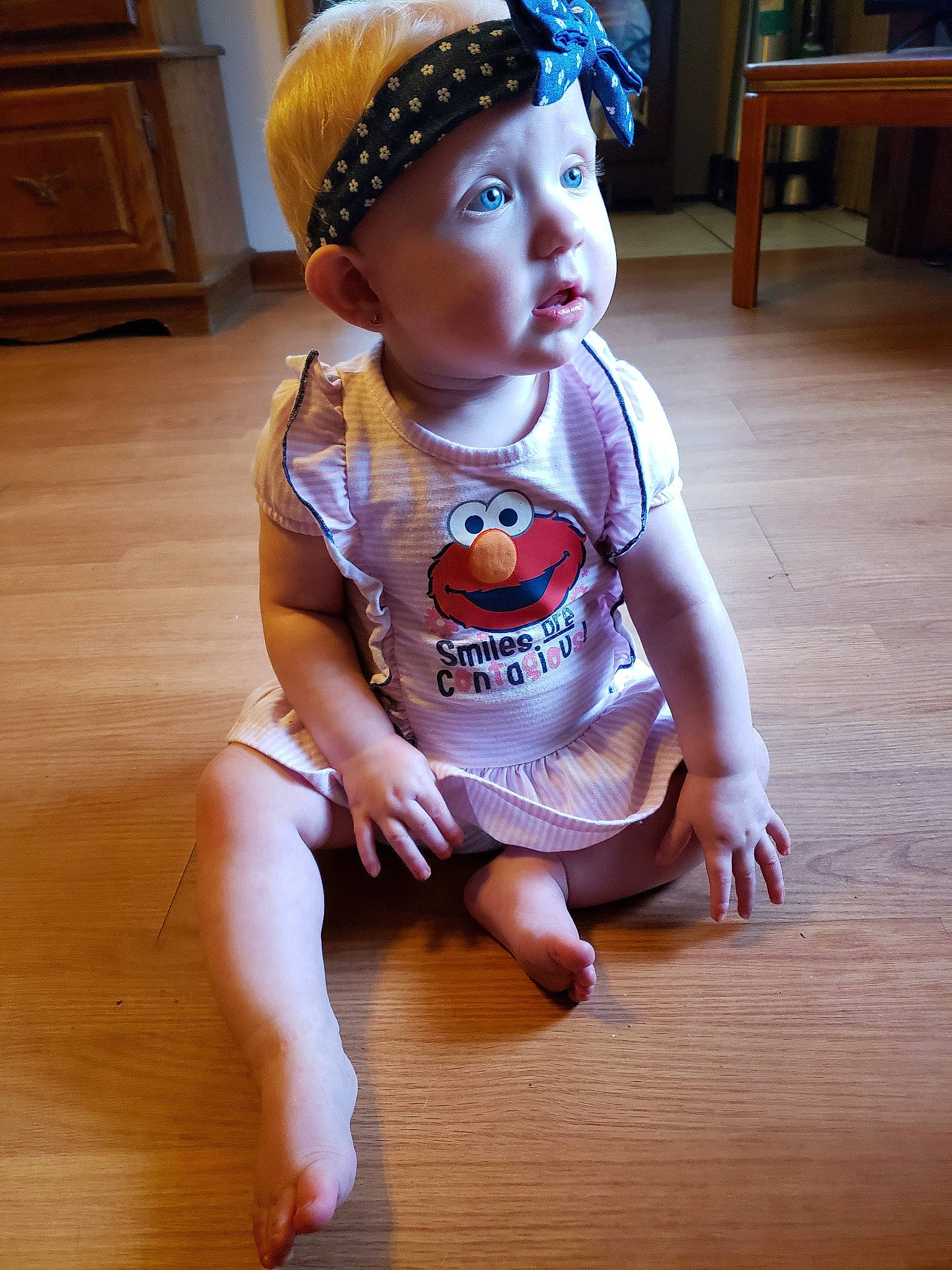 Anna is registered to the contest to win money with this photo: baby, baby_toddler_clothing, beanie, cap, cheek, child, floor, flooring, hair_accessory, hardwood, hat, headband, headgear, person, toddler, wood, wood_flooring