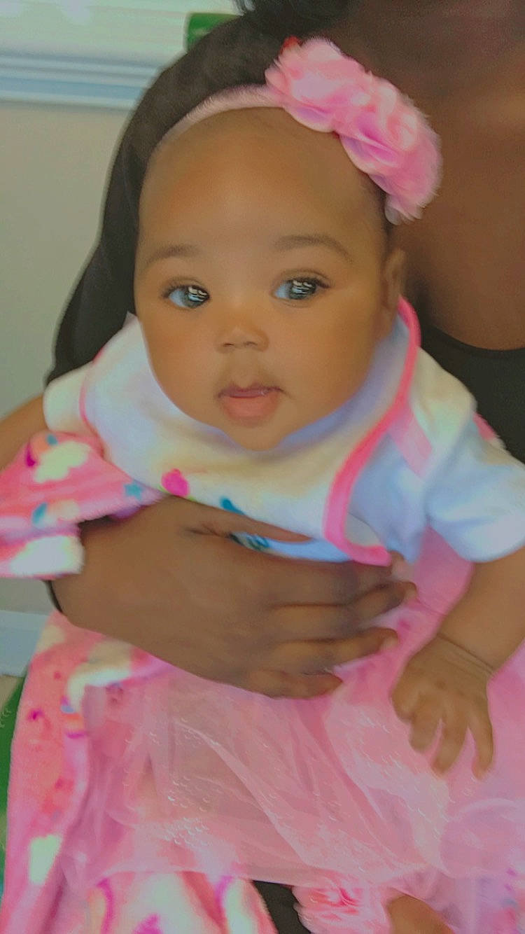 Leanni is registered to the contest to win money with this photo: baby, baby_toddler_clothing, cheek, child, dress, eye, eyelash, fashion_accessory, fun, gesture, happy, headband, headpiece, iris, lip, nose, person, pink, skin, sleeve