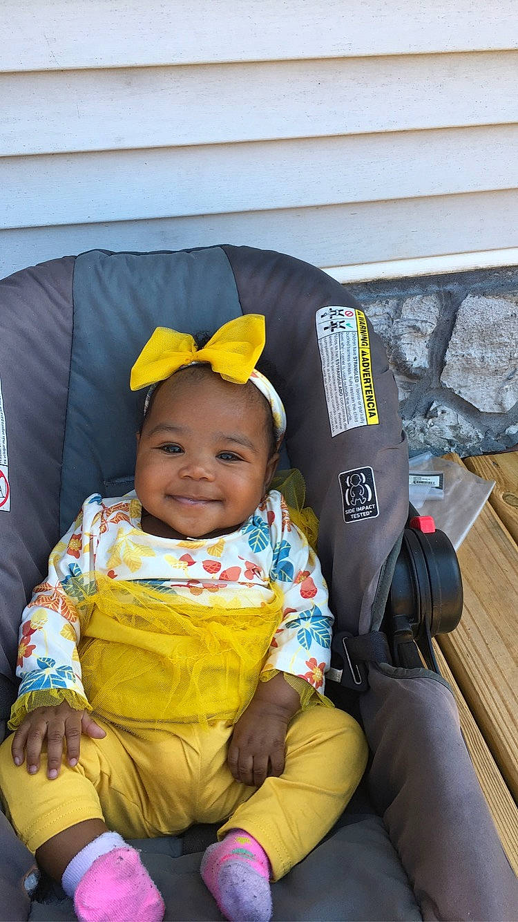Leanni joined the competition — help win amazing prizes! baby, baby_carriage, baby_products, baby_safety, baby_toddler_clothing, bag, car_seat, child, comfort, eye, fashion_accessory, fun, happy, joy, lap, person, product, sitting, smile, toddler