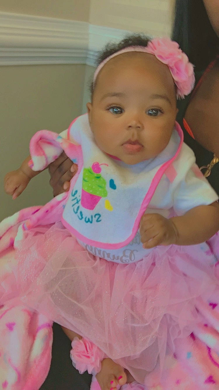 Leanni joined the competition — help win amazing prizes! baby, baby_products, baby_toddler_clothing, cheek, child, dress, eye, eyelash, face, happy, head, iris, magenta, peach, person, pink, ruffle, skin, sleeve, textile