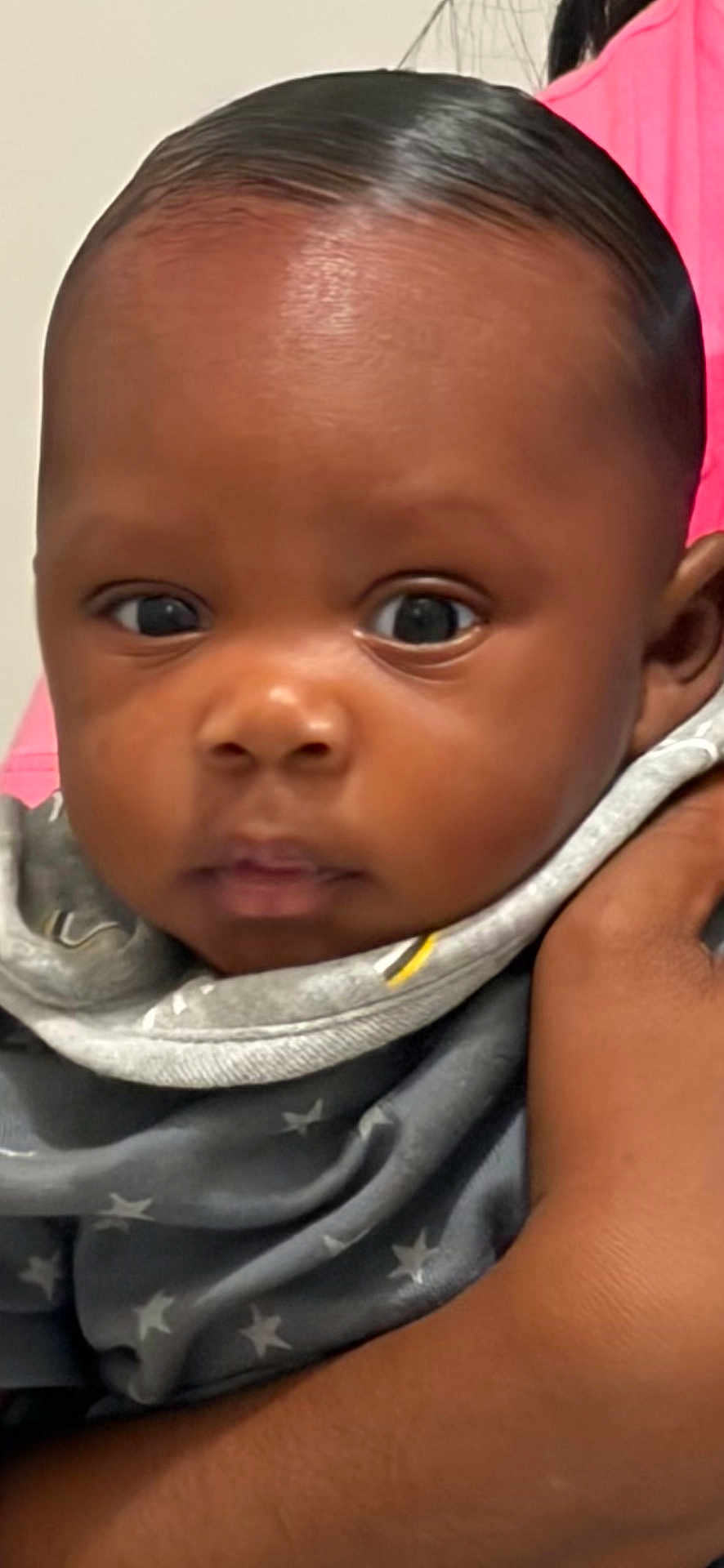 Jasia joined the competition — help win amazing prizes! baby, infant, face, eyes, hand, holding, clothing, blanket, star_pattern, person, portrait, indoor, cute, young_child, skin, head, expression, close_up, newborn, baby_girl