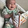 Matias joined the competition — help win amazing prizes! baby, child, smiling, overalls, bracelet, soft_toy, book, winnie_the_pooh, indoor, plush_chair, cute, happy, person, infant, portrait, clothing, sitting, handheld, cozy, reading