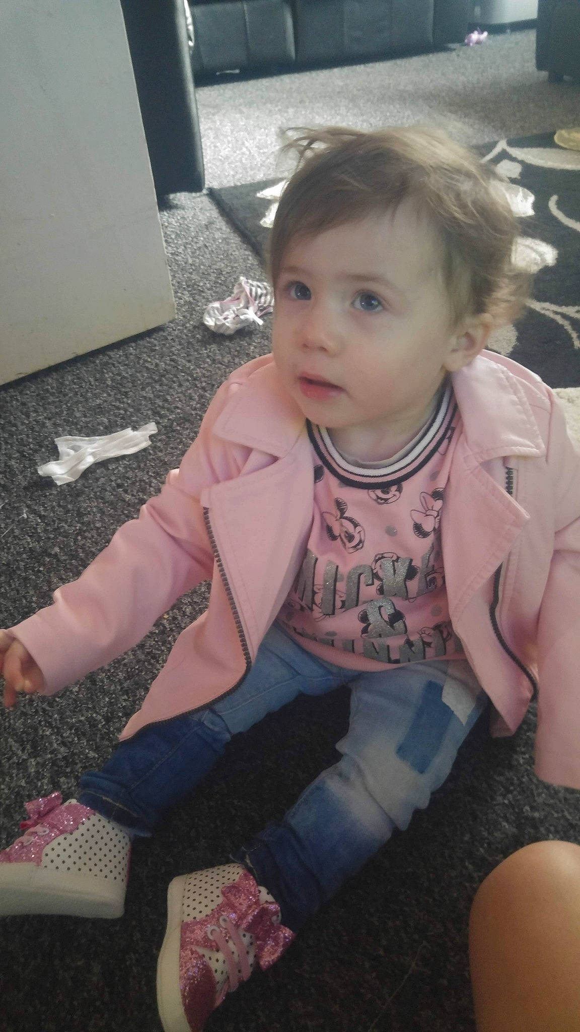 Amelia is registered to the contest to win money with this photo: arm, blond, cheek, child, day, eye, fun, girl, hair, hairstyle, head, human_hair_color, infant, leg, mouth, person, pink, sitting, skin, textile