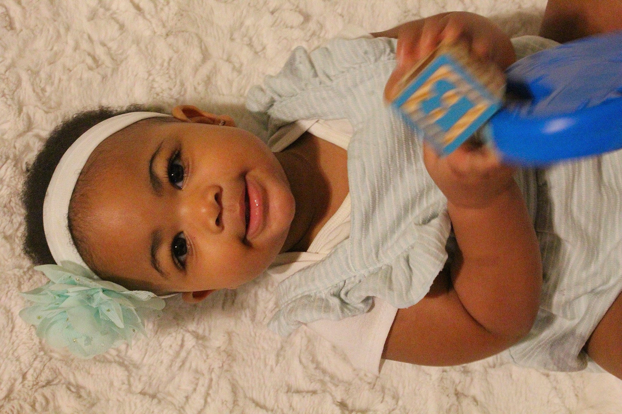 Imani joined the competition — help win amazing prizes! abdomen, baby, baby_toddler_clothing, child, comfort, elbow, eyelash, face, hand, happy, head, iris, linens, lip, mouth, nose, person, room, skin, smile