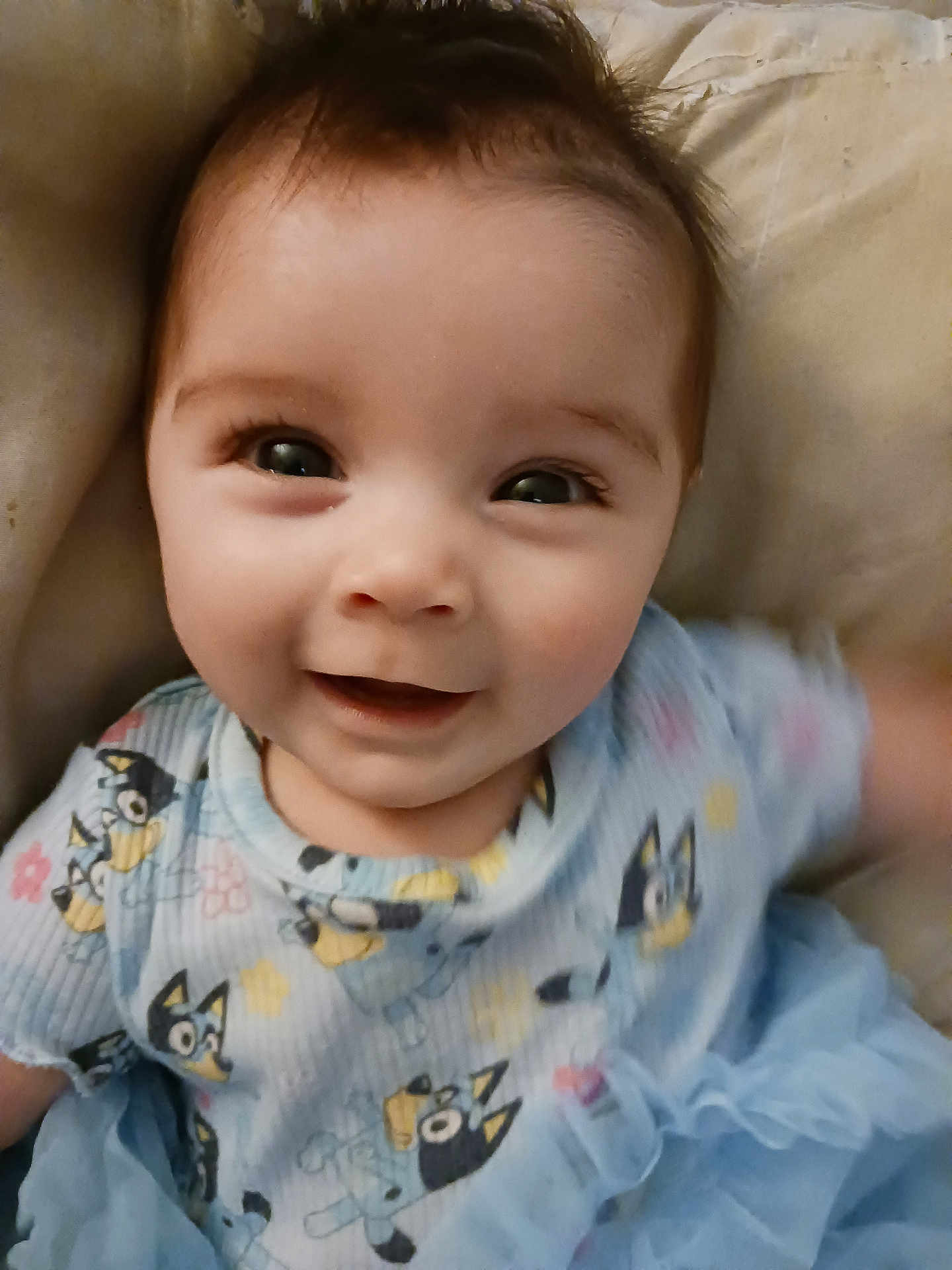 Matilda joined the competition — help win amazing prizes! baby, smiling, child, infant, cute, portrait, happy, clothing, blue_dress, patterned_shirt, face, eyes, expression, sitting, indoor, soft_light, closeup, young_child, adorable, joyful