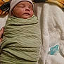 Matilda is registered to the contest to win money with this photo: baby, newborn, sleeping, wrapped, blanket, hat, pacifier, soft, white, cozy, peaceful, infant, child, cute, resting, indoors, person, portrait, young, sleep