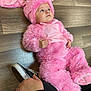 Ryan joined the competition — help win amazing prizes! baby, cap, child, costume, doll, ear, fur, headgear, magenta, outerwear, pink, skin, stuffed_toy, textile, toddler, toy