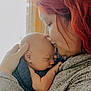 Remy joined the competition — help win amazing prizes! baby, adult, red_hair, sleeping, hug, portrait, indoor, love, tenderness, blanket, close_up, person, holding, cozy, face, skin, hand, warm_light, window, cuddle