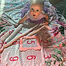 baby, infant, child, sitting, smiling, surprised_expression, portrait, floral_blanket, pink_clothing, dress, milestone_photo, number_card, five_months, indoor, bedroom, wood_floor, sunlight, toy, cozy, family_photo