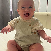 Violet joined the competition — help win amazing prizes! baby, bed, child, clothing, curtain, cute, fan, foot, hand, happy, headwear, indoor, infant, light, overalls, person, portrait, sitting, skin, smiling