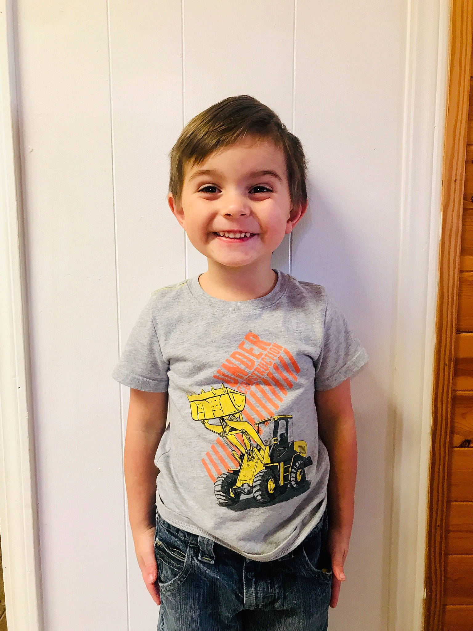 River is registered to the contest to win money with this photo: child, chin, face, fun, jeans, joy, person, photography, smile, standing, t_shirt, toddler, top, vacation, yellow