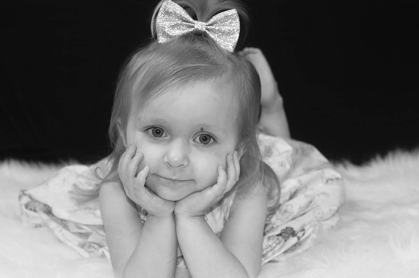 Talyia is registered to the contest to win money with this photo: baby, black_and_white, child, eye, face, hair_accessory, head, headpiece, iris, lip, monochrome, monochrome_photography, person, photograph, photography, portrait, portrait_photography, skin, smile, toddler