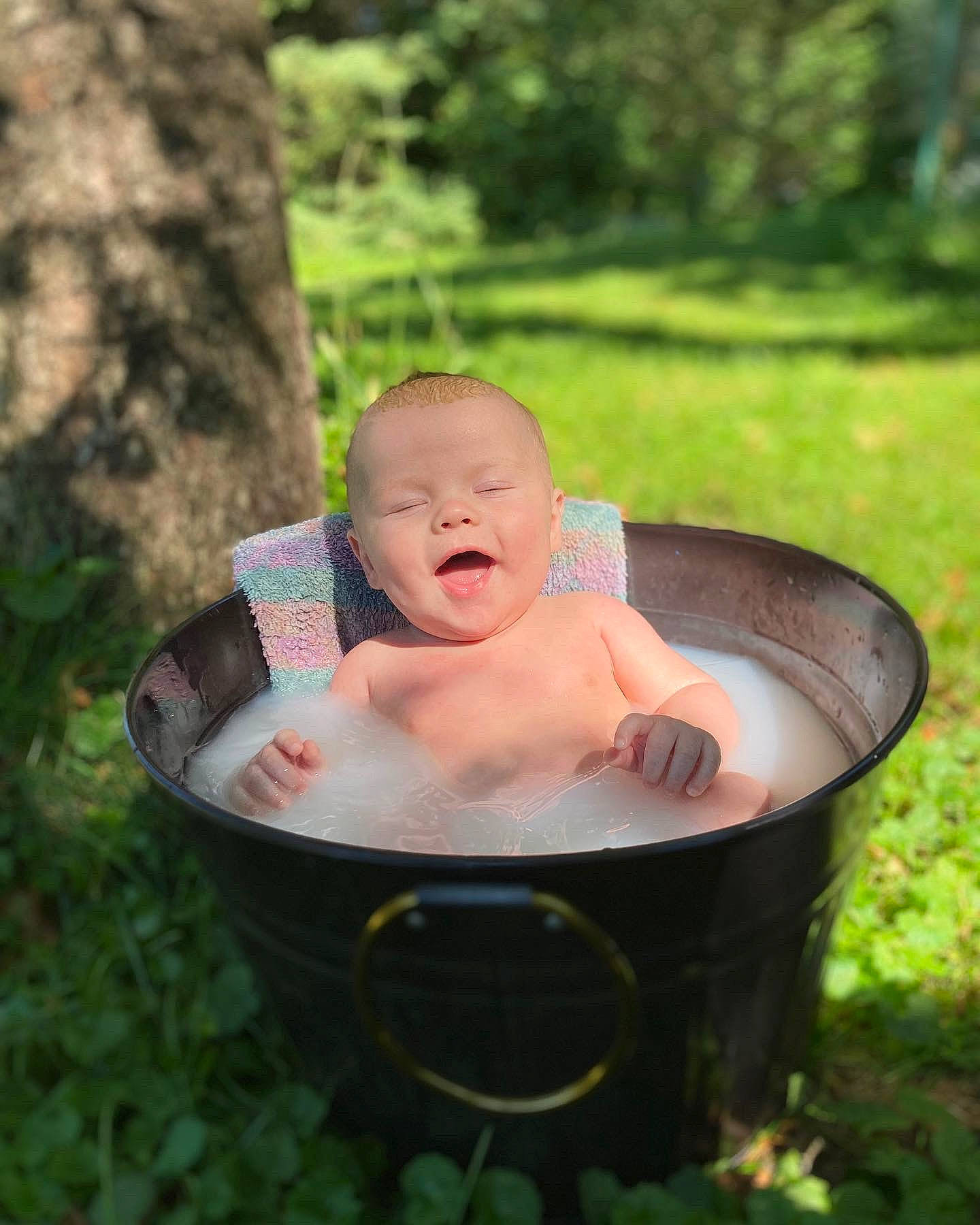 Oaklen joined the competition — help win amazing prizes! baby, baby_products, bathing, chair, child, face, fun, garden, grass, happy, leaf, leisure, people_in_nature, person, plant, recreation, sitting, toddler, tree, water