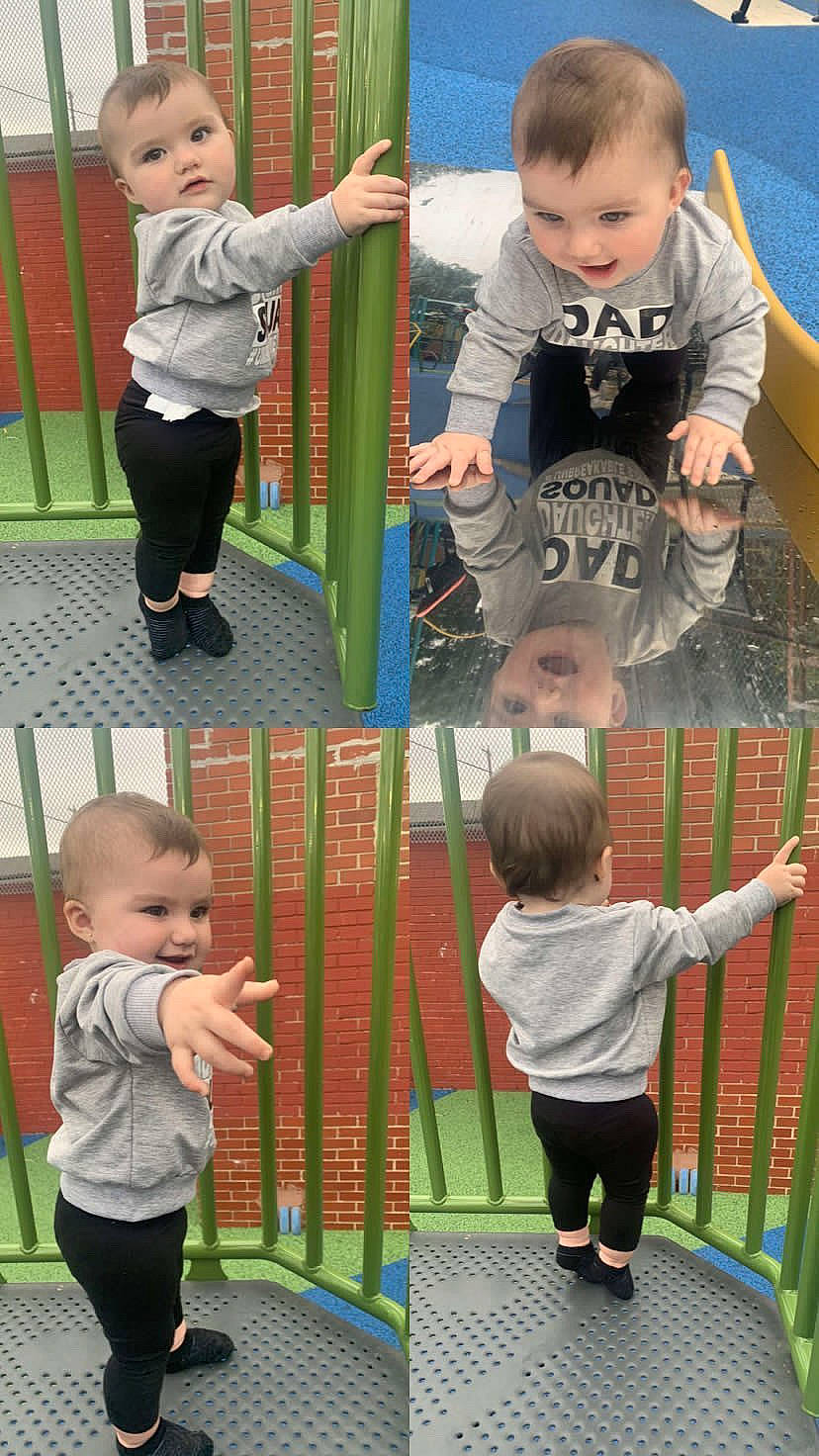 Arielle is registered to the contest to win money with this photo: arm, baby, baby_toddler_clothing, child, clothing, facial_expression, fun, green, head, leisure, organ, outerwear, people, person, photograph, product, sleeve, standing, t_shirt, toddler