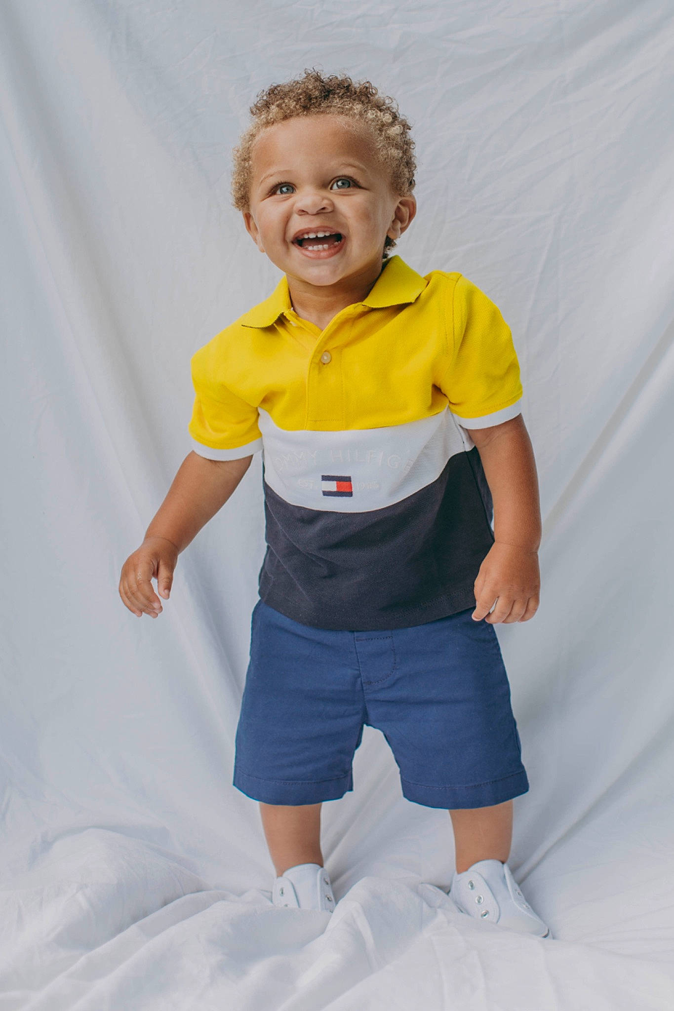 Matthew is registered to the contest to win money with this photo: baby_toddler_clothing, denim, elbow, electric_blue, face, gesture, hand, happy, head, human_body, jeans, knee, person, recreation, shorts, sleeve, smile, sportswear, t_shirt, toddler