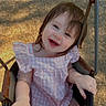 child, toddler, smiling, swing, outdoor, sunlight, pink_dress, baby, happy, playground, seat, metal, grass, joy, summer, cute, person, portrait, hair, fun