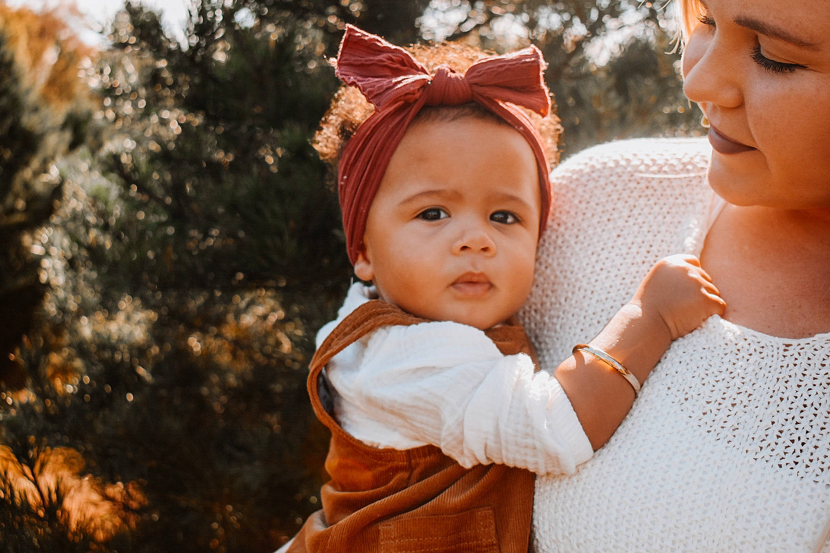 Remi joined the competition — help win amazing prizes! baby, event, eye, face, fun, gesture, grass, happy, headpiece, headwear, interaction, iris, jewellery, lip, outerwear, people_in_nature, person, plant, skin, standing