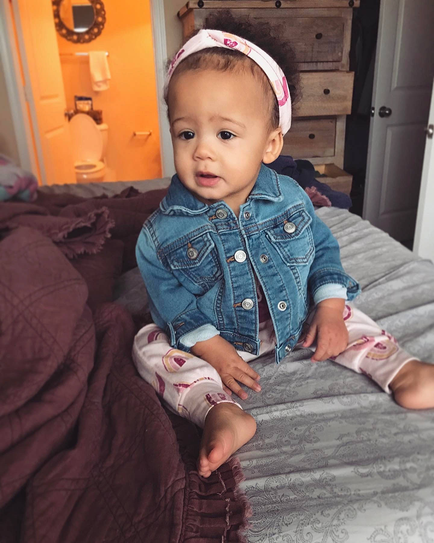 Remi is registered to the contest to win money with this photo: baby, baby_toddler_clothing, cheek, child, comfort, denim, door, face, flash_photography, flooring, fun, pattern, person, plaid, portrait_photography, sitting, skin, sleeve, t_shirt, toddler