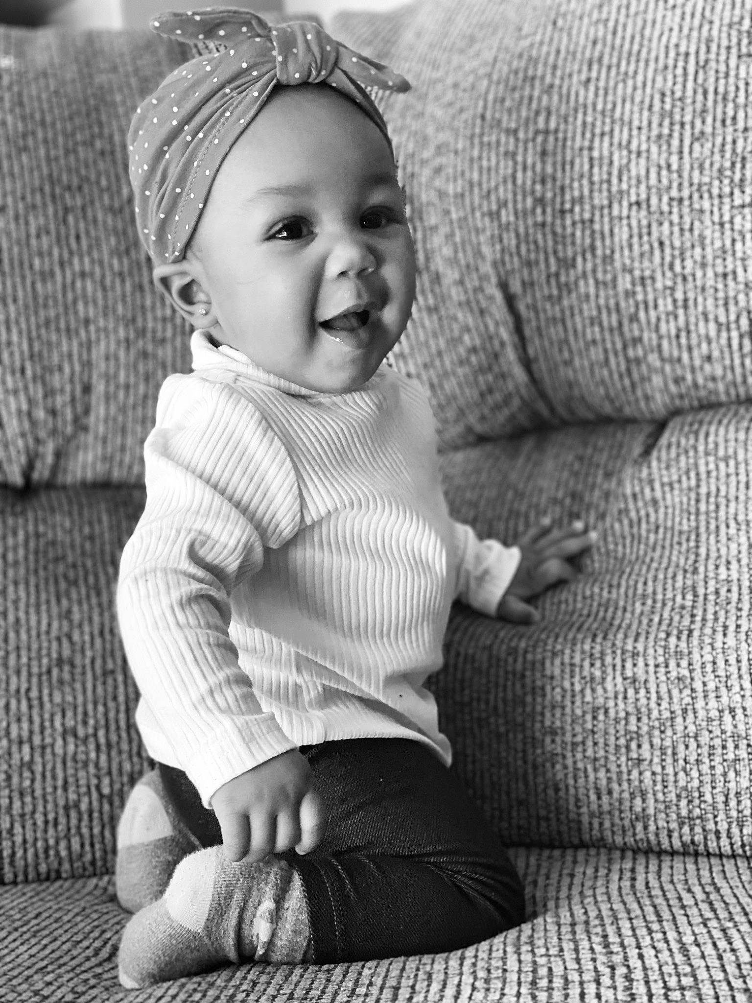 Malaysia is registered to the contest to win money with this photo: baby, baby_toddler_clothing, black, black_and_white, cheek, comfort, eye, grey, head, headwear, human, leg, monochrome, person, photograph, skin, sleeve, smile, style, textile