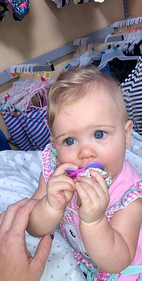 Averi is registered to the contest to win money with this photo: baby, baby_toddler_clothing, biting, cheek, child, ear, eyelash, finger, gesture, hand, happy, iris, lip, mouth, nail, nose, organ, person, skin, thumb