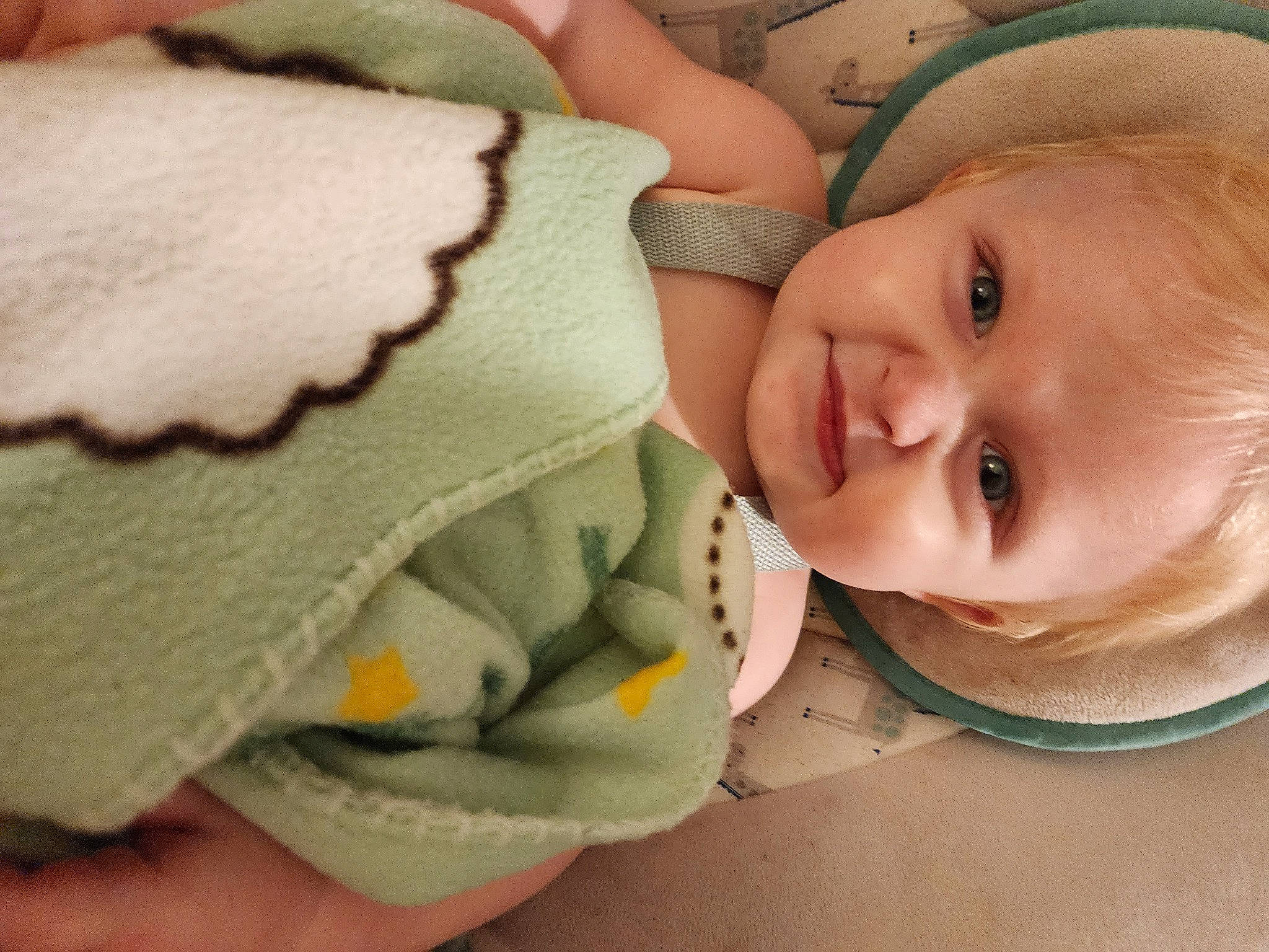 Leon is registered to the contest to win money with this photo: baby, baby_products, baby_sleeping, baby_toddler_clothing, bedtime, cheek, child, chin, close_up, comfort, happy, human_body, linens, mouth, nose, person, room, skin, smile, thumb