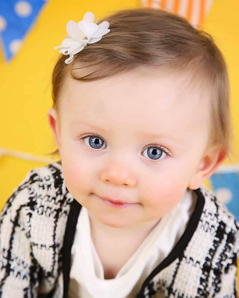 Connie is registered to the contest to win money with this photo: baby, beauty, brown_hair, cheek, child, child_model, ear, face, fashion_accessory, forehead, hair, hair_accessory, hairstyle, headband, person, photography, skin, smile, toddler
