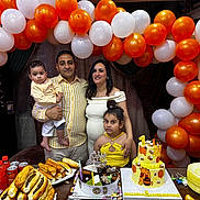 Augustine joined the competition — help win amazing prizes! baby, balloons, birthday, bread, cake, celebration, child, colorful, daughter, decorations, family, father, festive, food, indoor, mother, party, people, smiling, table
