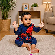 Augustine is registered to the contest to win money with this photo: toddler, child, indoor, carpet, toy_blocks, spiderman_outfit, hands_up, plant, lamp, sofa, wooden_floor, photo_frame, potted_plant, furniture, cute, playtime, living_room, expression, casual_clothing, home