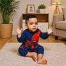 toddler, child, indoor, carpet, toy_blocks, spiderman_outfit, hands_up, plant, lamp, sofa, wooden_floor, photo_frame, potted_plant, furniture, cute, playtime, living_room, expression, casual_clothing, home