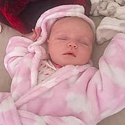 Aria joined the competition — help win amazing prizes! baby, sleeping, robe, pink, white, blanket, soft, cozy, infant, child, indoor, face, closed_eyes, person, head, cute, relaxing, plush, bed, comfort