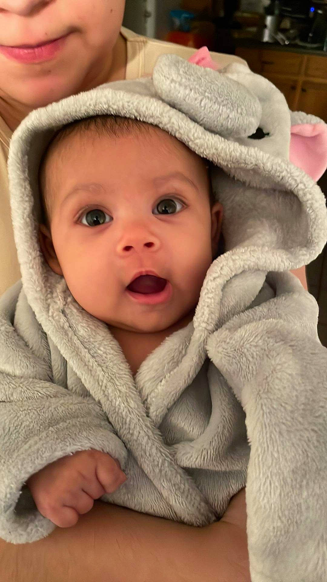 Ariah is registered to the contest to win money with this photo: baby, cap, cheek, chin, comfort, eye, eyelash, face, facial_expression, gesture, happy, headgear, iris, lip, mouth, nose, outerwear, person, product, skin