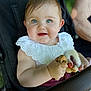 baby, child, blue_eyes, smiling, stroller, toy, white_collar, cute, portrait, infant, hand, face, outdoor, person, seatbelt, closeup, skin, expression, happy, young