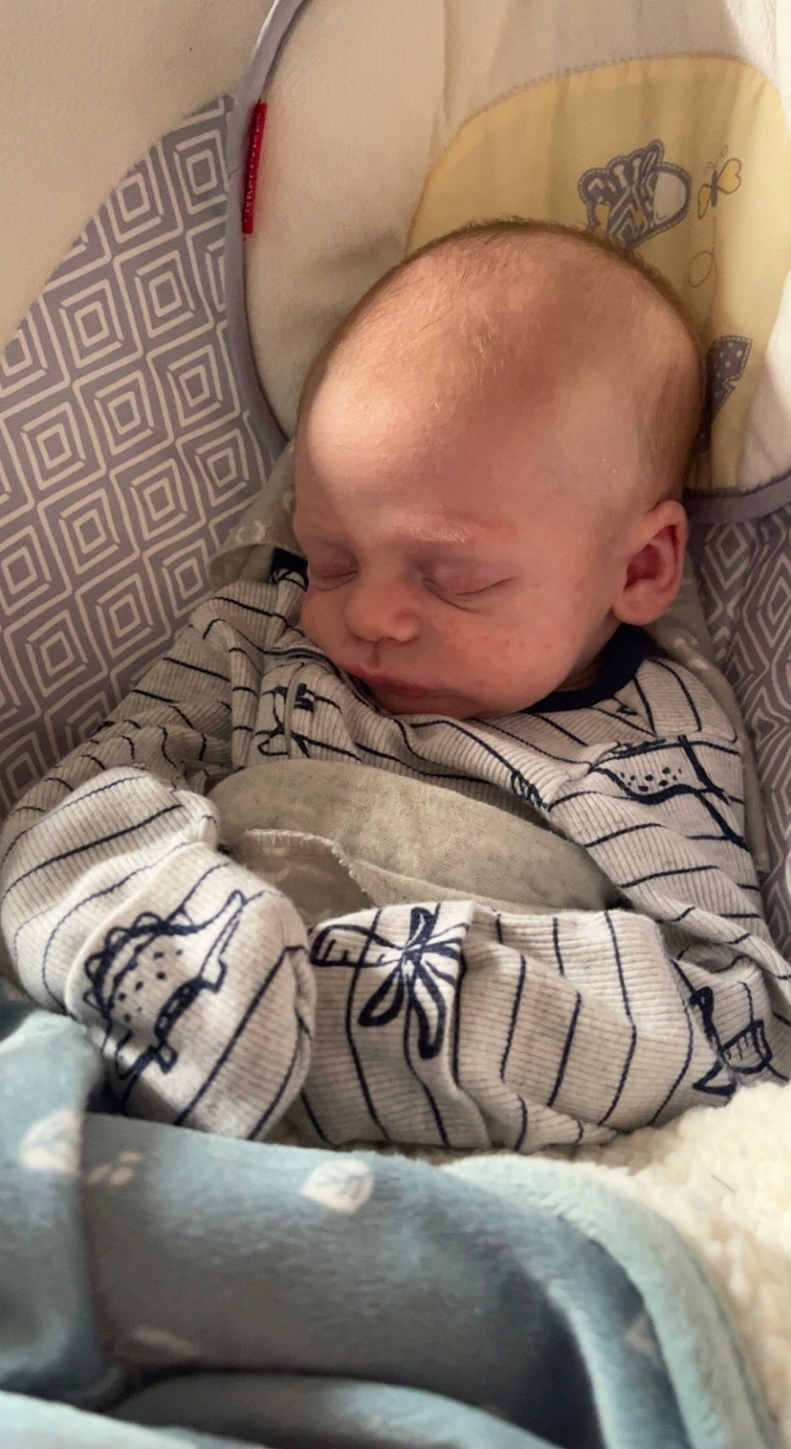 Malakai joined the competition — help win amazing prizes! arm, baby, baby_products, baby_sleeping, baby_toddler_clothing, bedtime, cheek, child, chin, comfort, face, head, linens, mouth, nap, pattern, person, sitting, skin, sleeve