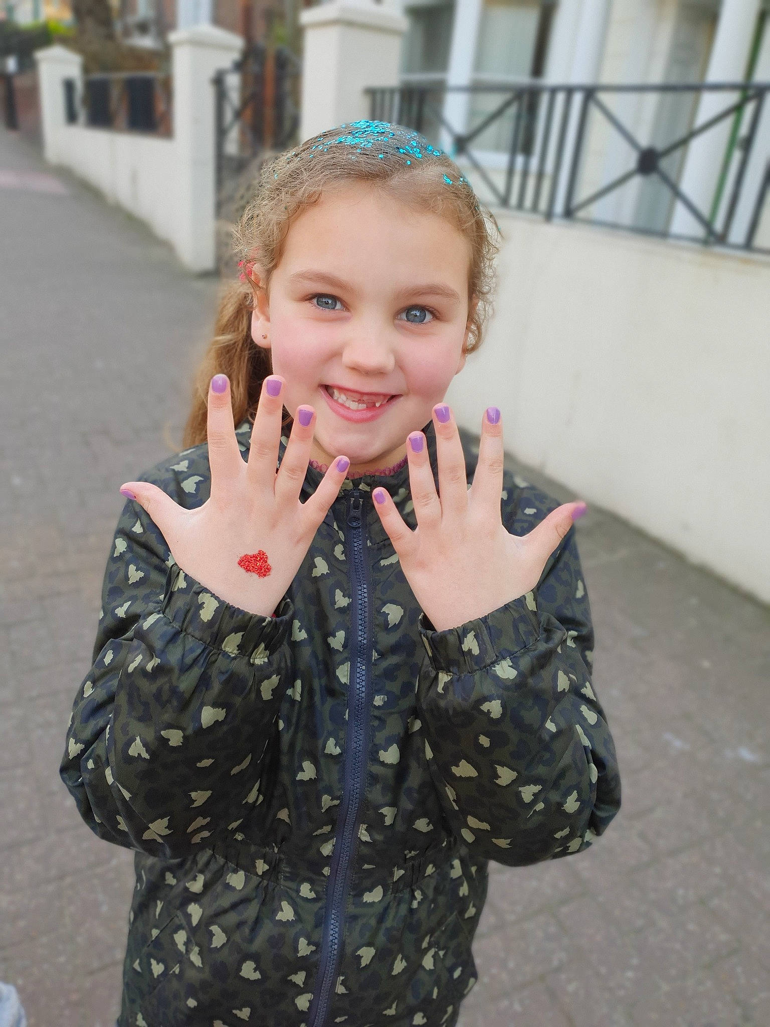 Lacie is registered to the contest to win money with this photo: beauty, cheek, child, design, eye, face, finger, gesture, hand, head, joy, lip, nose, outerwear, pattern, person, smile, snapshot, street_fashion, textile