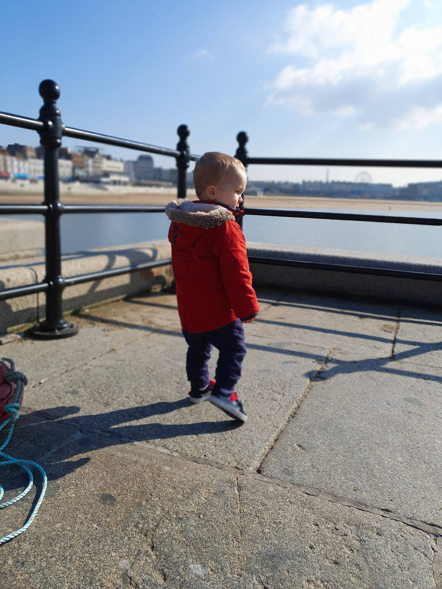 Oakley joined the competition — help win amazing prizes! beach, child, leg, outerwear, person, pier, play, sea, shoe, sky, standing, toddler, tourism, vacation, walking, water