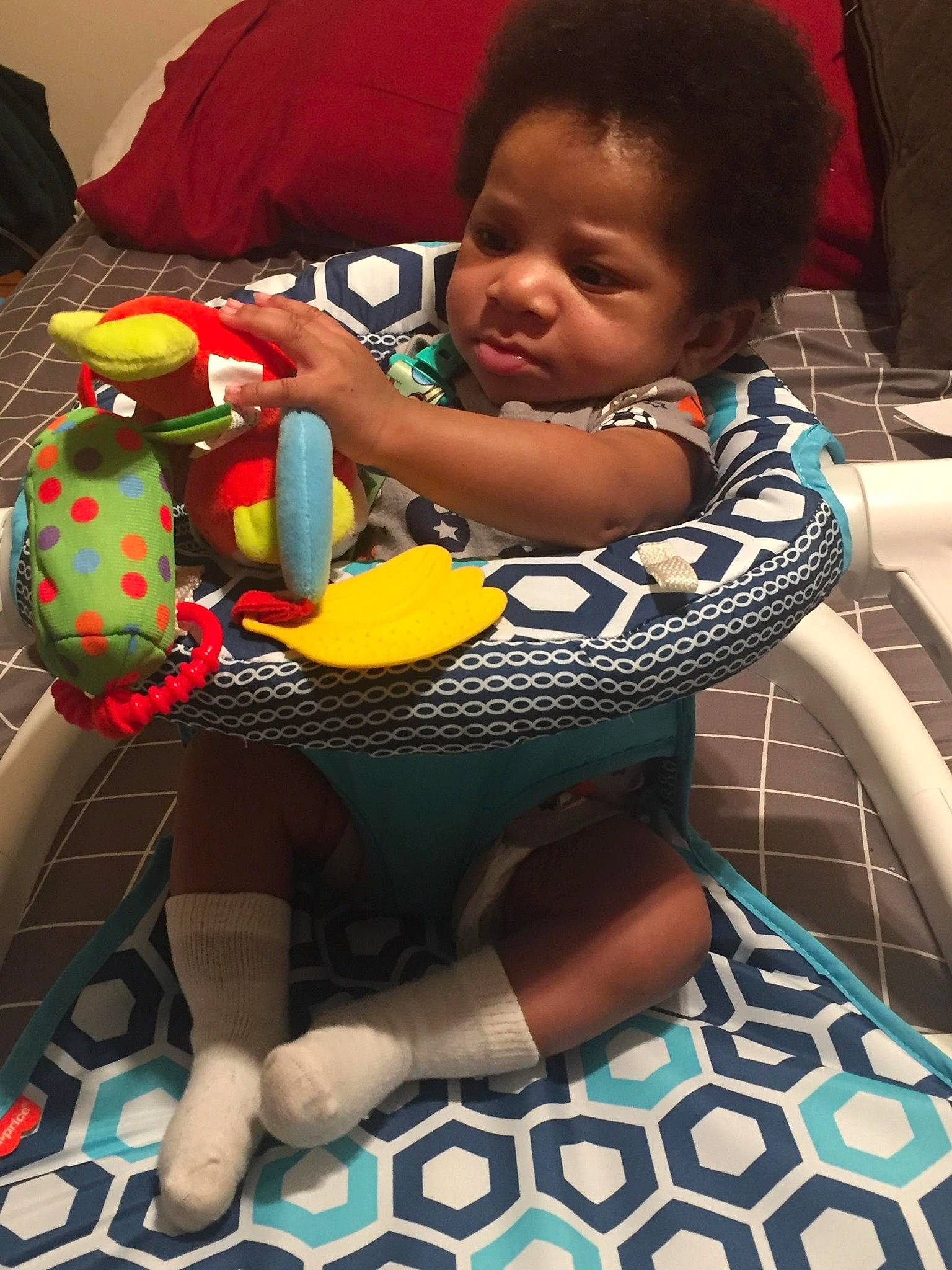 Kaizen is registered to the contest to win money with this photo: baby, baby_carriage, baby_products, baby_safety, baby_toddler_clothing, blue, chair, cheek, child, comfort, fun, green, happy, head, lap, person, sitting, skin, thigh, toddler