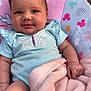 Willow is registered to the contest to win money with this photo: baby, blanket, blue, child, clothing, comfort, cute, face, hand, happy, headwear, indoors, infant, pattern, pink, portrait, seat, skin, smiling, toddler