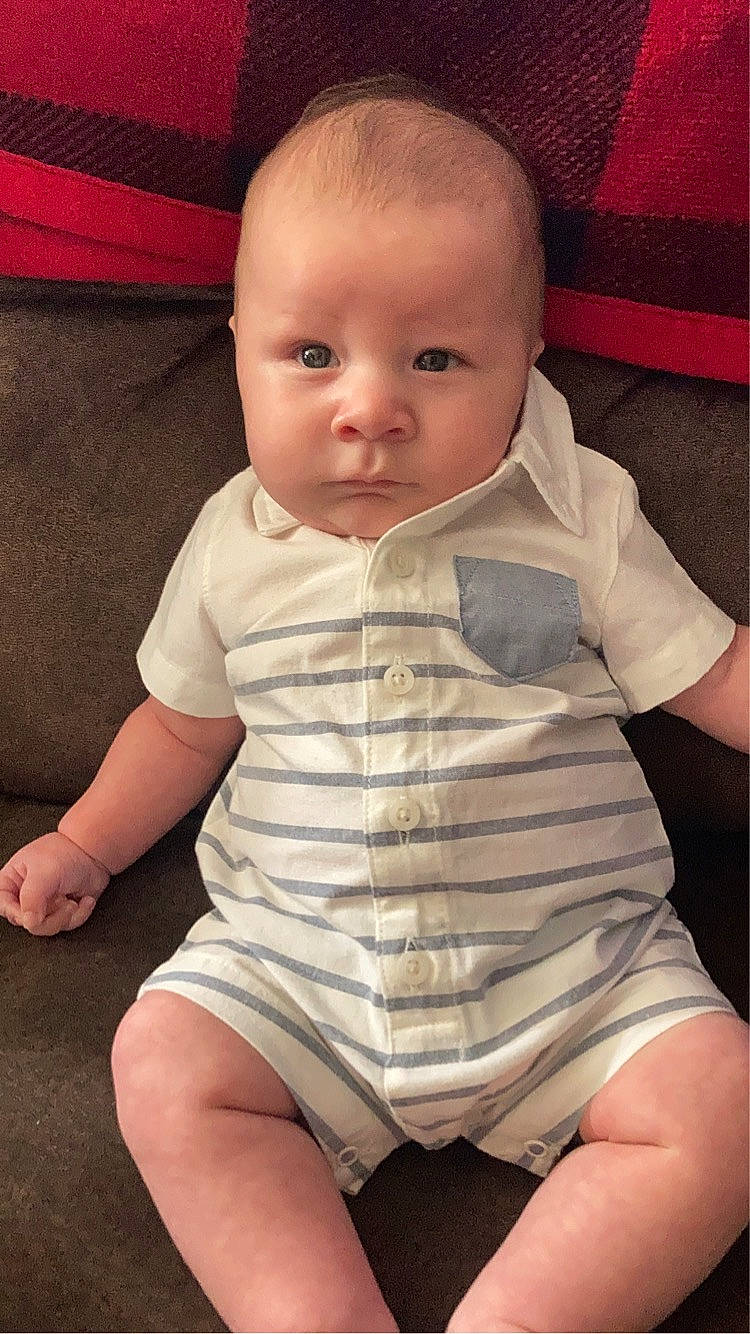 Kenai is registered to the contest to win money with this photo: baby_toddler_clothing, cheek, comfort, eye, finger, head, human_body, iris, leg, lip, mouth, neck, nose, organ, person, pink, skin, sleeve, stomach, thigh