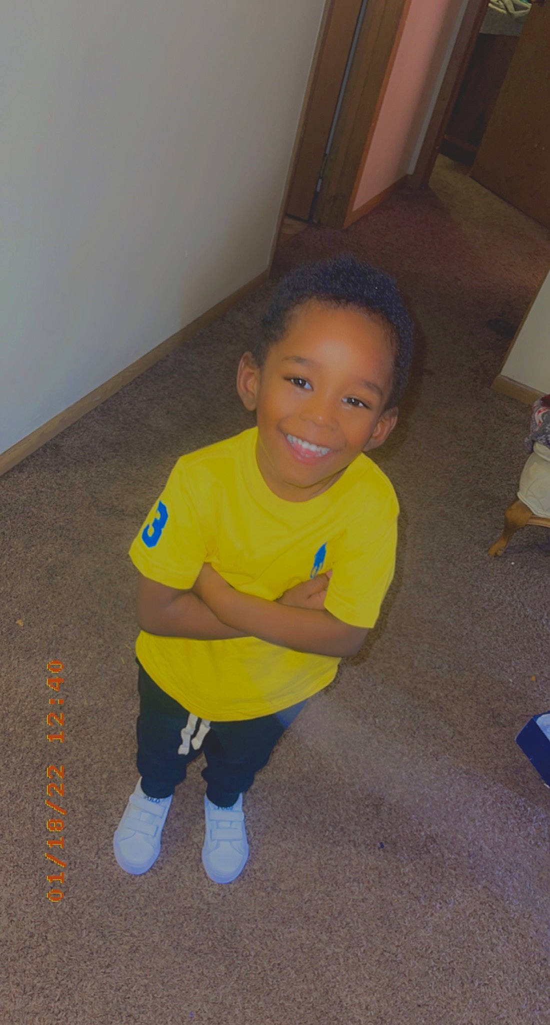 Hakeem is registered to the contest to win money with this photo: baby_toddler_clothing, child, chin, eye, floor, flooring, fun, happy, hardwood, head, joint, joy, leg, mammal, person, shorts, skin, sleeve, smile, standing