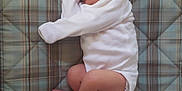 Silas joined the competition — help win amazing prizes! baby, bed, child, cozy, curled_up, cute, fabric, indoors, infant, lying_down, newborn, patterned, peaceful, plaid_mattress, portrait, resting, sleeping, small_feet, soft_texture, white_onesie