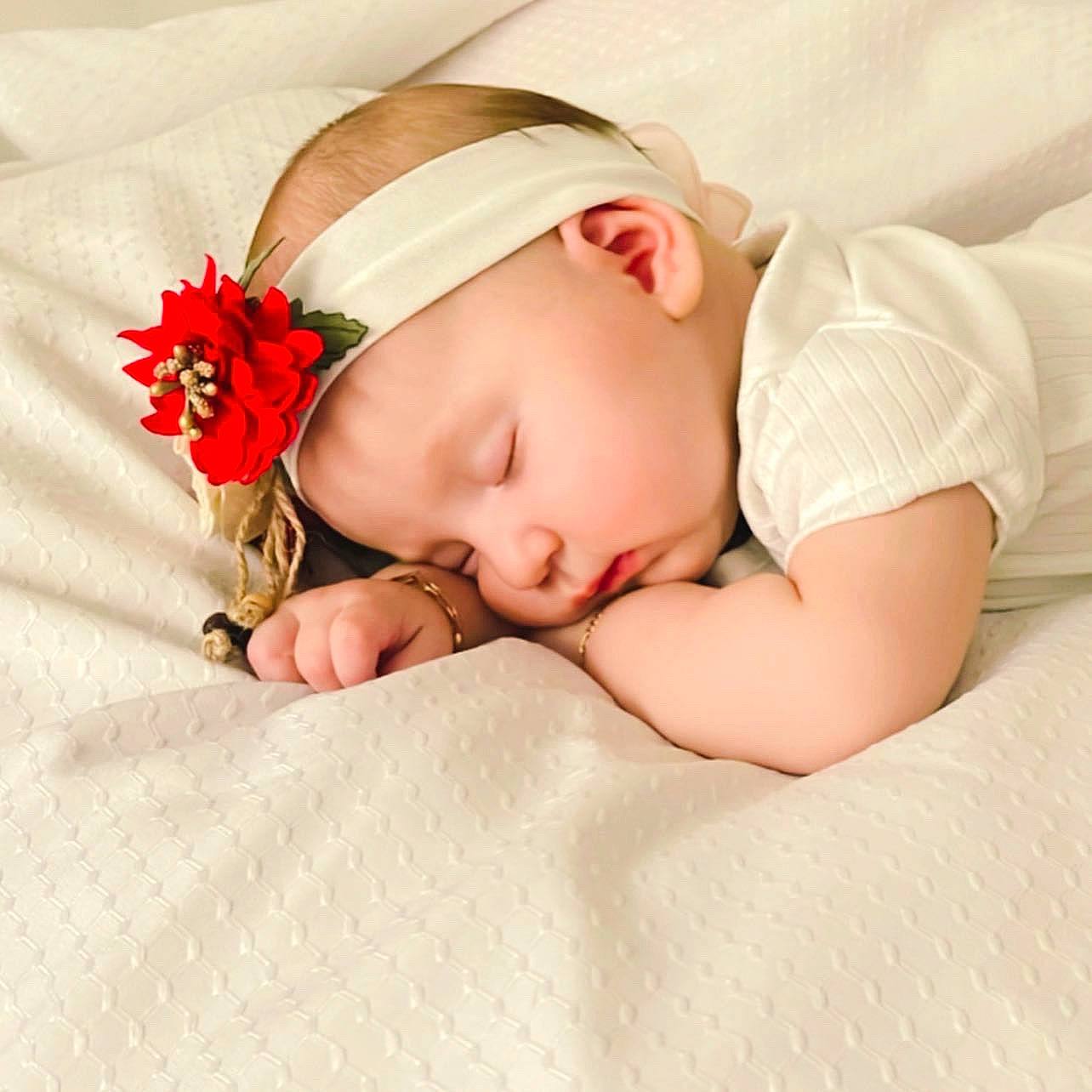 Liana joined the competition — help win amazing prizes! arm, baby, baby_sleeping, baby_toddler_clothing, cap, comfort, eyelash, fashion_accessory, hair_accessory, hand, headband, headgear, headpiece, lip, neck, pattern, person, petal, skin, sleeve