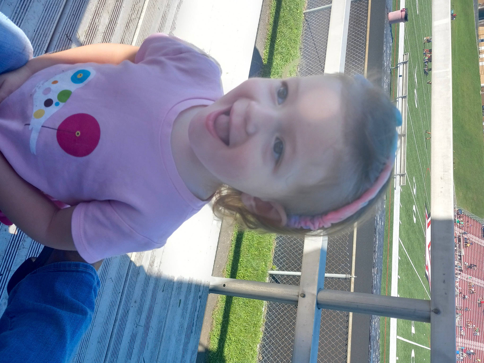 Maddison joined the competition — help win amazing prizes! baby, baby_toddler_clothing, blue, child, city, electric_blue, facial_expression, fence, fun, grass, happy, joy, leisure, magenta, mesh, outdoor_play_equipment, person, play, purple, smile