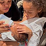 Kai Green joined the competition — help win amazing prizes! baby, bottle, child, feeding, girl, hair_bow, indoor, person, woman, chair, cloth, toddler, care, family, nurturing, skin, hand, face, seat, floor
