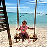 toddler, child, swing, beach, sand, ocean, sea, sky, clouds, rope, wood, swimsuit, sunny, vacation, water, boats, outdoor, summer, play, holiday