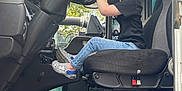 Blake is registered to the contest to win money with this photo: boy, car, car_interior, carseat, child, clothing, face, footwear, head, homedecor, jeans, male, pants, person, photography, portrait, shoe, sitting, transportation, vehicle